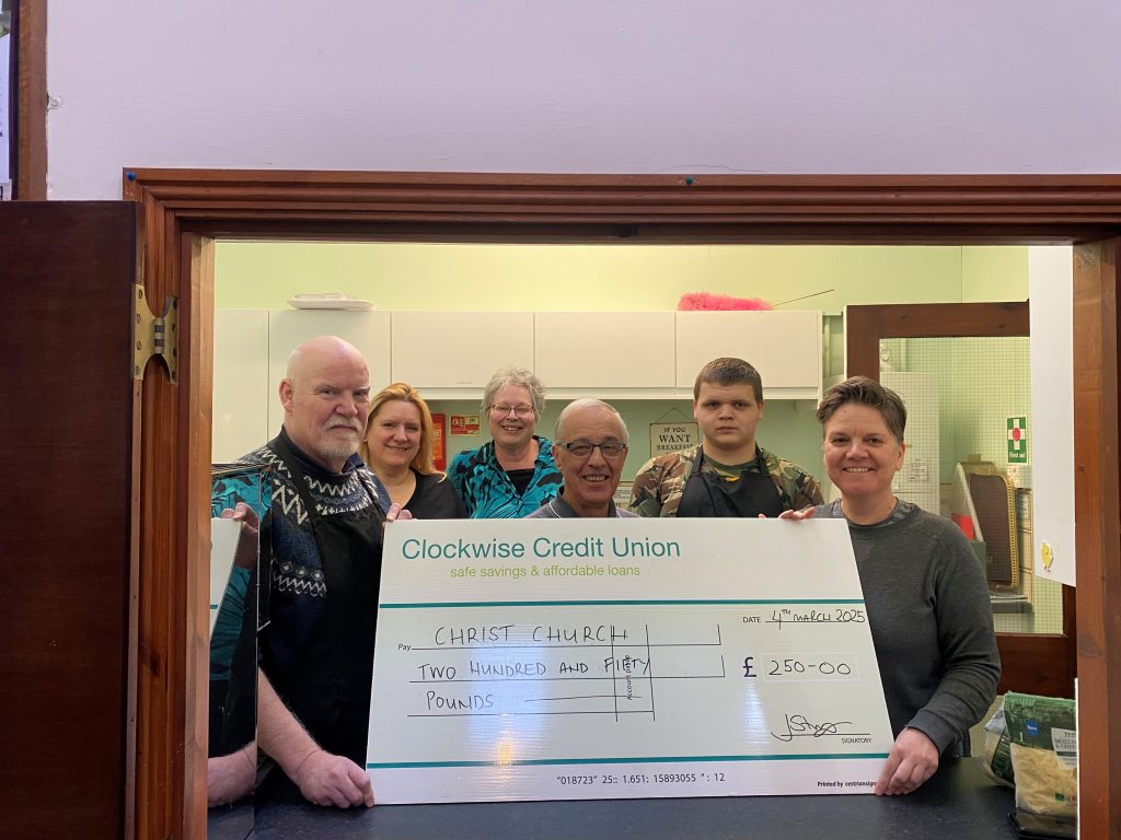 Reverend Peter Bone (far left) and treasurer Brian Clare (centre). 